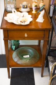 $625. Pecan mid-century side table with shelf, drawer and raised edge. Round crystal glass drawer pull.
