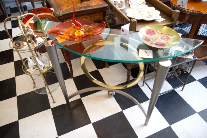 $700 Mixed metal Art Deco curved table with revers heavy glass top. Circa 1920.