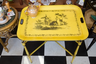$480 Large yellow toleware tray table on folding metal stand. Circa 1950s.